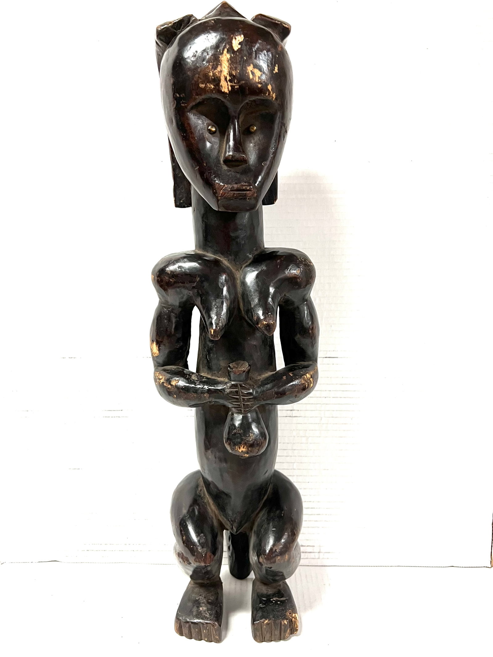 Fang Statue: Title: Fang Statue Description: African Tribal Art Carved Wood Fang Statue Materials: Wood Date/Period: Late 20th Century Size: 23.5' h x 5.5" w Reserve: $280.00 Shipping: Domestic: Flat-rate of