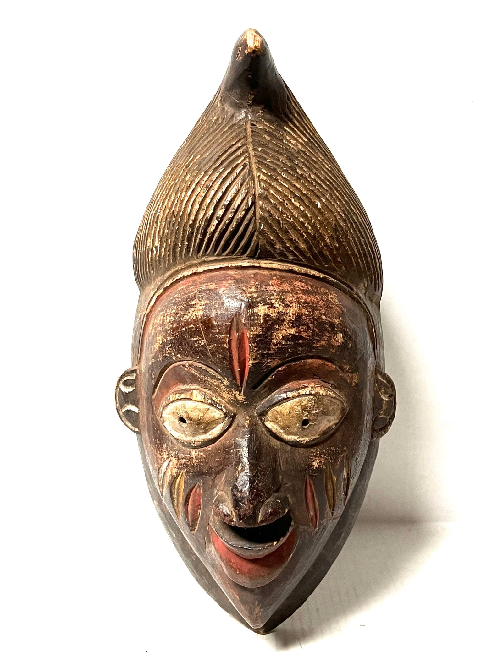 Yuroba Mask: Title: Yuroba Mask Description: African Tribal Art Carved Wood Yuroba Mask Materials: Wood Date/Period: Late 20th Century Size: 15" h x 8" w Reserve: $180.00 Shipping: Domestic: Flat-rate of $30.00