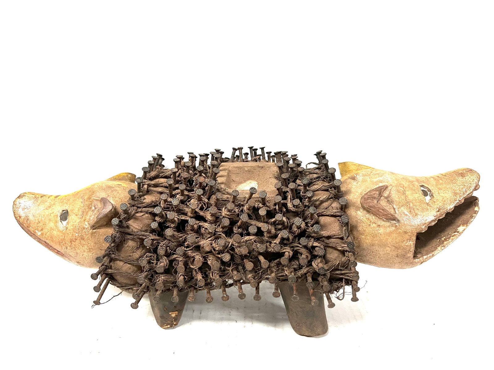Bacongo Dog Nail Fetish Statue: Title: Bacongo Dog Nail Fetish Statue Description: African Tribal Art Carved Wood Bacongo Dog Nail Fetish Statue Materials: Wood Date/Period: Late 20th Century Size: 5" h x 14.5" w Reserve: $300.00