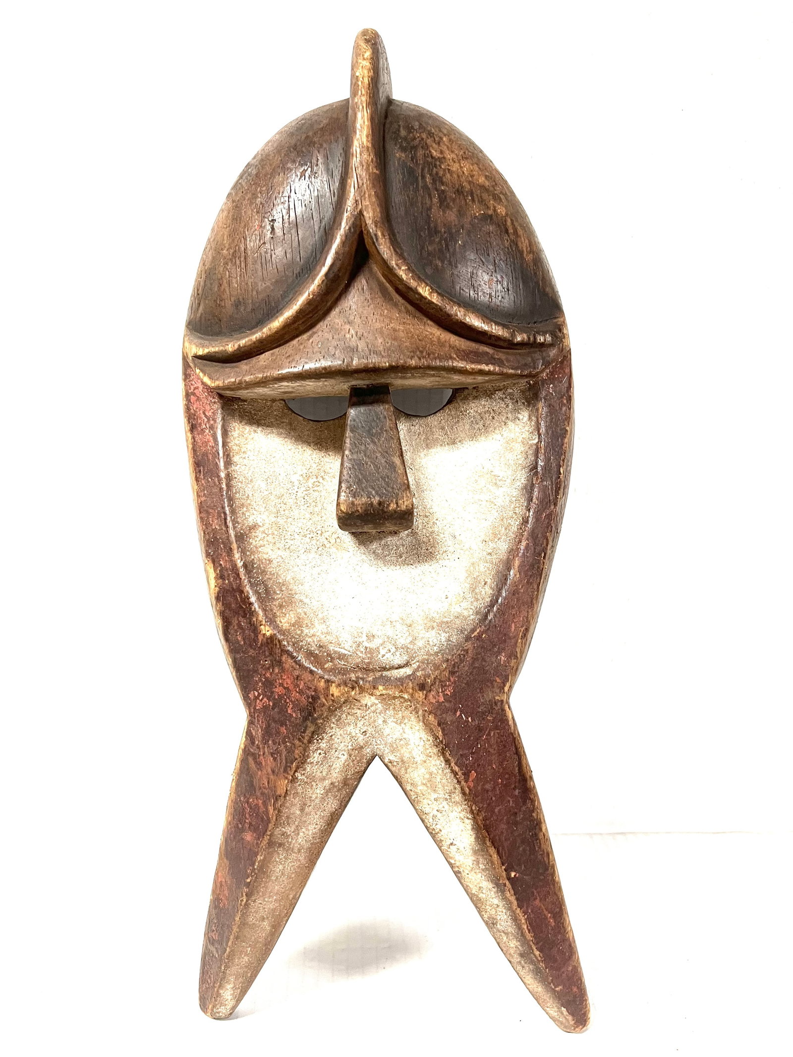 Kwele Mask: Title: Kwele Mask Description: African Tribal Art Carved Wood Kwele Mask Materials: Wood Date/Period: Late 20th Century Size: 20" h x 9" w Reserve: $200.00 Shipping: Domestic: Flat-rate of $30.00 to