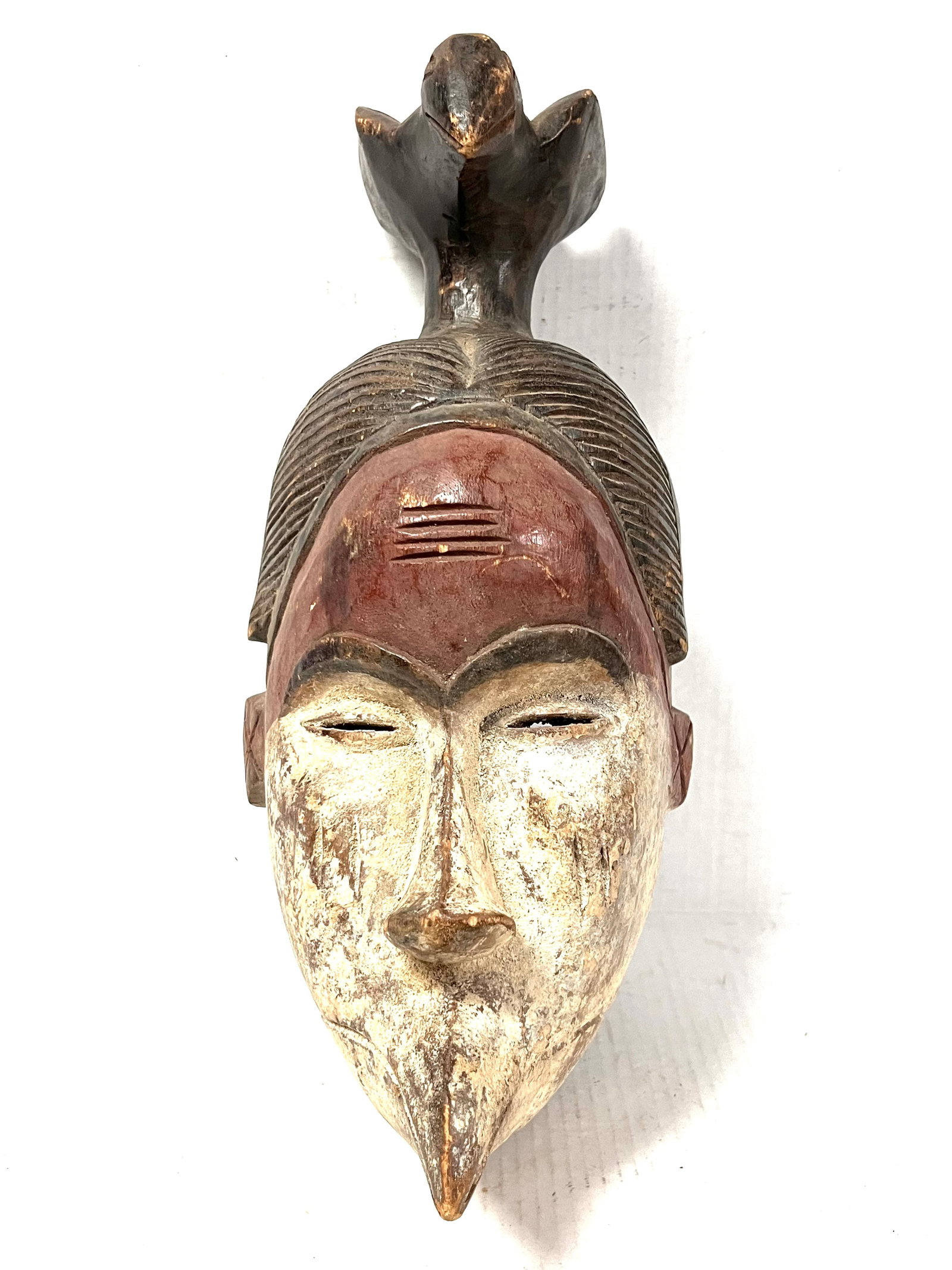 Ibo Mask: Title: Ibo Mask Description: African Tribal Art Carved Wood ibo Mask Materials: Wood Date/Period: Late 20th Century Size: 16.5" h x 7" w Reserve: $200.00 Shipping: Domestic: Flat-rate of $40.00 to