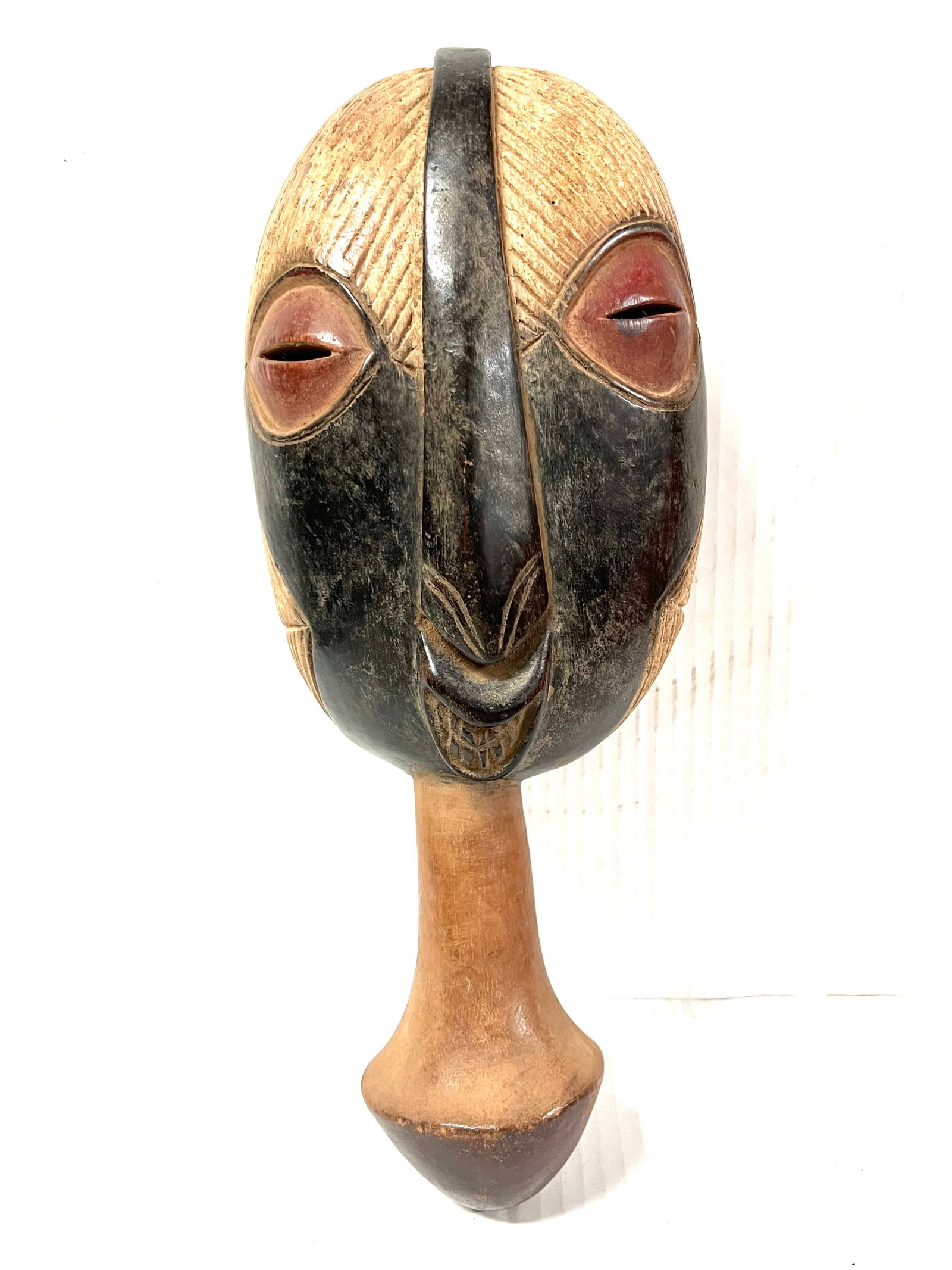 Bembe Mask: Title: Bembe Mask Description: African Tribal Art Carved Wood Bembe Mask Materials: Wood Date/Period: Late 20th Century Size: 16.5" h x 7" w Reserve: $180.00 Shipping: Domestic: Flat-rate of $40.00