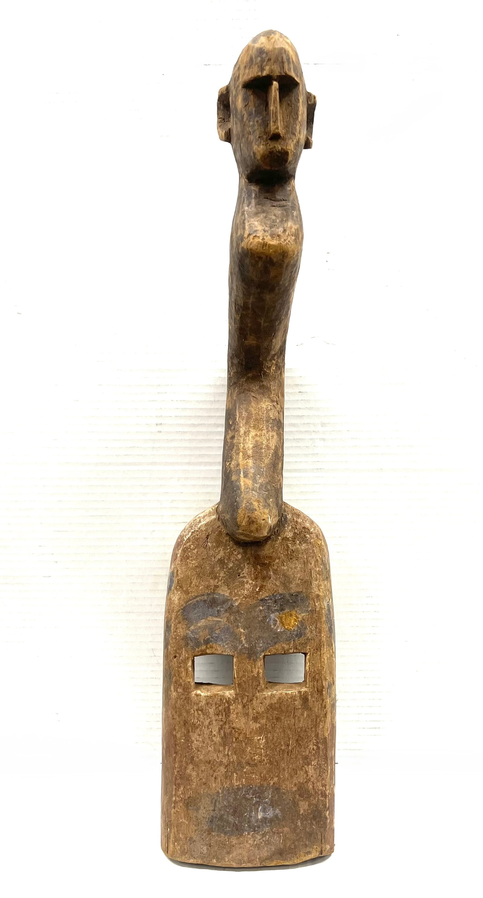 Dogon Mask: Title: Dogon Mask Description: African Tribal Art Carved Wood Dogon Mask Materials: Wood Date/Period: Late 20th Century Size: 28" h x 6.5" w Reserve: $240.00 Shipping: Domestic: Flat-rate of $30.00