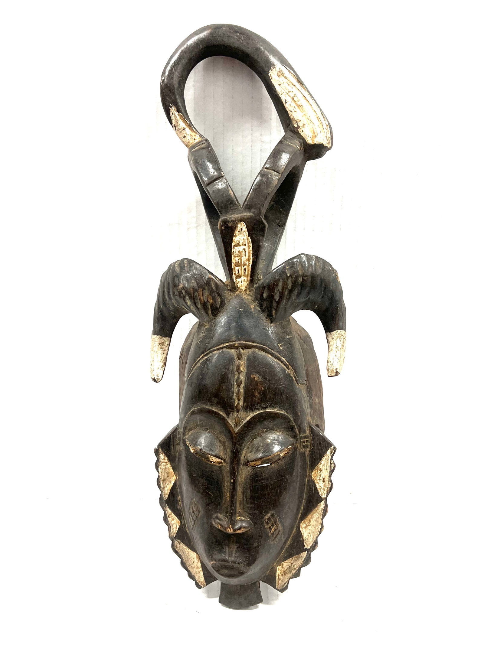 Yaure Mask: Title: Yaure Mask Description: African Tribal Art Carved Wood Yaure Mask Materials: Wood Date/Period: Late 20th Century Size: 18.5" h x 7" w Reserve: $200.00 Shipping: Domestic: Flat-rate of $40.00