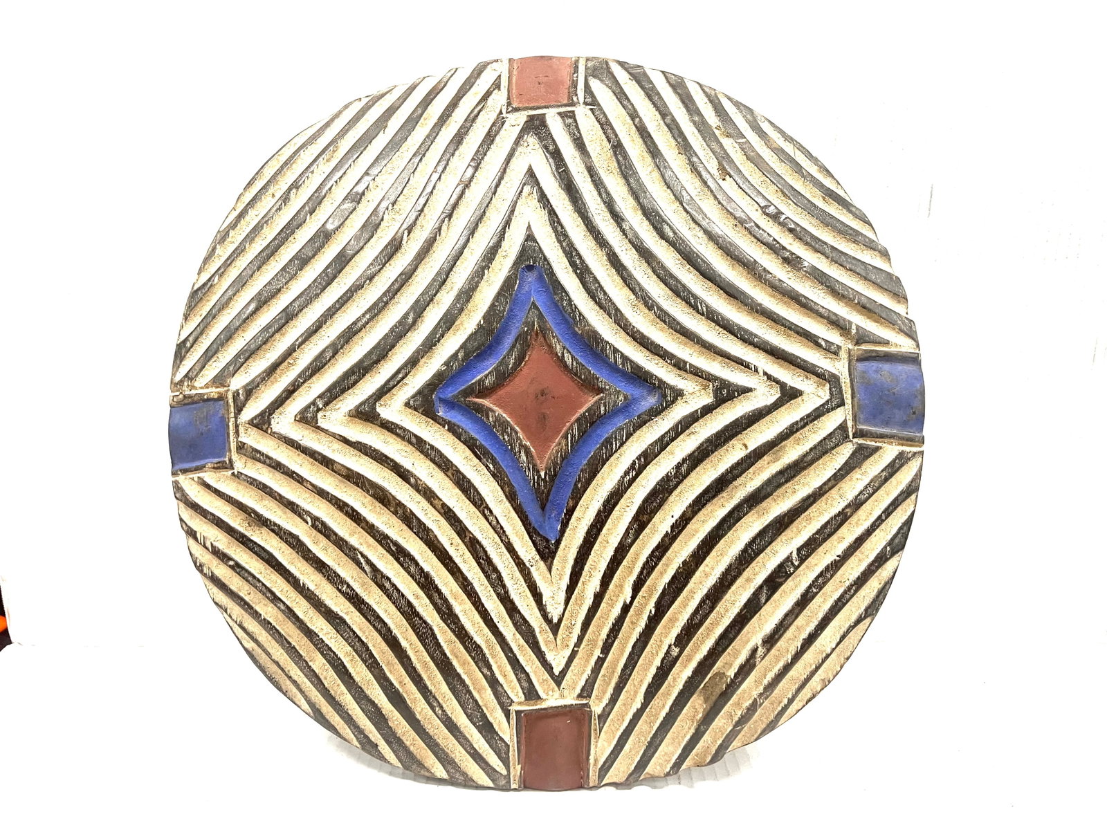 Zulu Shield: Title: Zulu Shield Description: African Tribal Art Carved Wood Zulu Shield Materials: Wood Date/Period: Late 20th Century Size: 19" h x 19" w Reserve: $300.00 Shipping: Domestic: Flat-rate of $40.00