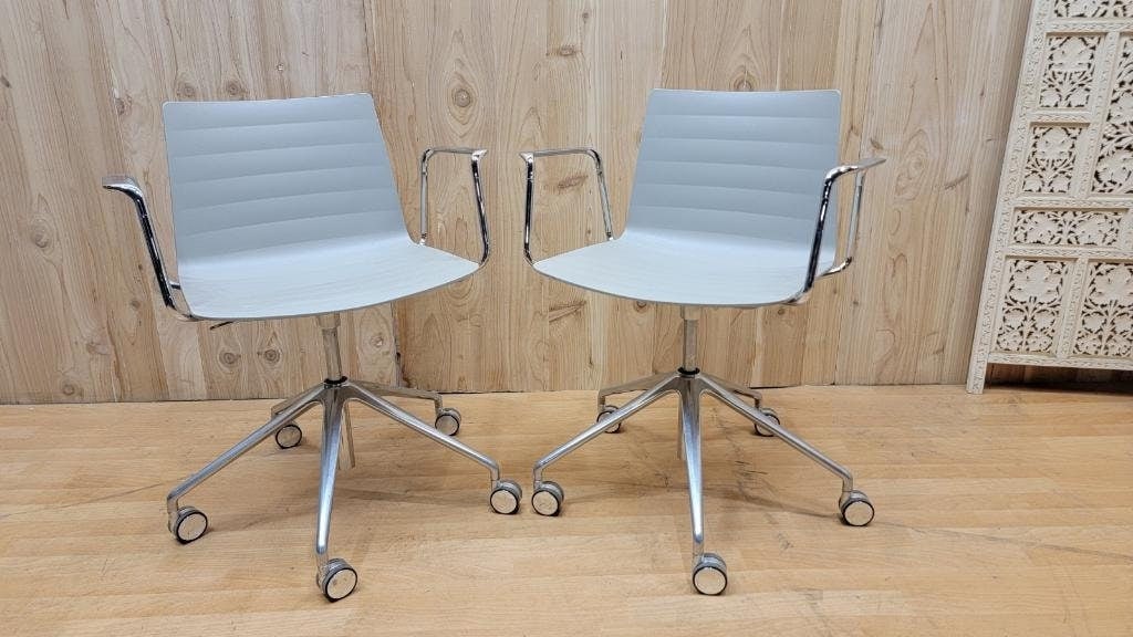Modern Piergiorgio Cazzaniga Flex Collection Swivel Armchairs for Andreu World - Pair: Title: Modern Piergiorgio Cazzaniga Flex Collection Swivel Armchairs for Andreu World - Pair Description: HighlightsMaterials: metal, leather, aluminumOverall width: 27.25 inchesOverall height: 28.25