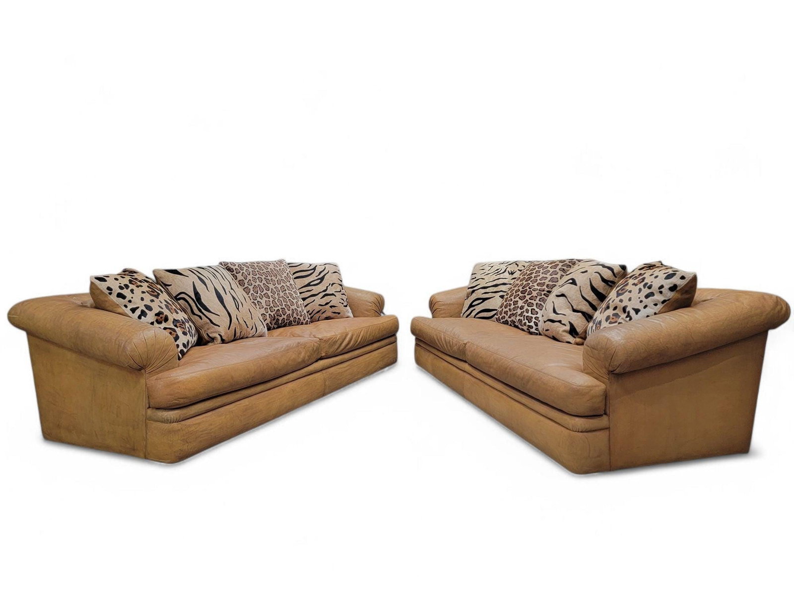 Vintage Distressed Rolled Arm Sofas by A. Rudin with Custom Pillows - Pair: Title: Vintage Distressed Rolled Arm Sofas by A. Rudin with Custom Pillows - Pair Description: Materials: cowhide, leatherVintage Modern Oversized Distressed Full Grain Cognac Leather Rolled Arm Sofas