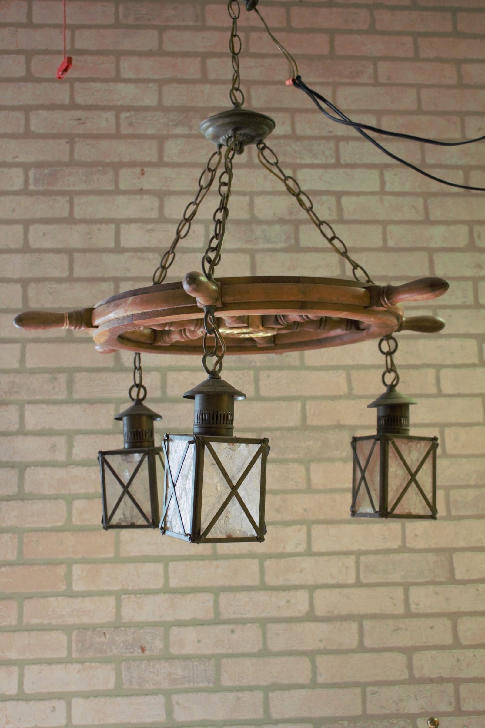 Vintage Nautical Ship Wheel Chandelier with Three Lanterns: Title: Vintage Nautical Ship Wheel Chandelier with Three Lanterns Description: Vintage from the 1990sMaterials: Glass, metal, woodVintage Nautical Theme Ship Wheel Chandelier with Three Glass Hanging