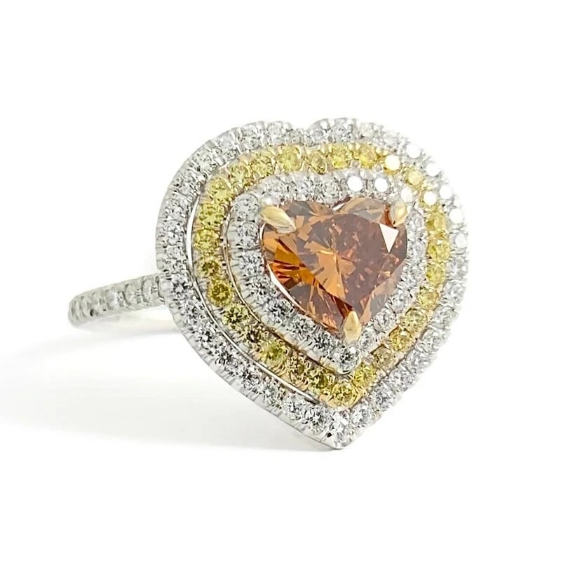 GIA Fancy Brown Orange Yellow Heart Diamond Halo Ring 18K White Gold 1.92 CTW: GIA Fancy Brown Orange Yellow Heart Diamond Halo Ring 18K White Gold 1.92 CTW This is a gorgeous and unique ring! Please let us know if you have any questions! Diamonds: 1.92 ctw; 1 heart cut 1.02 ct,