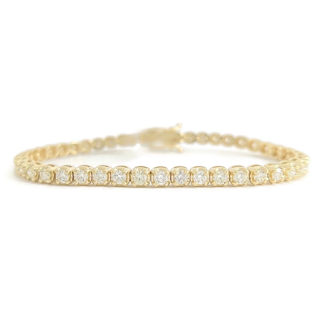 Round Diamond Buttercup Tennis Bracelet 14K Yellow Gold, 7 Inches, 3.75 CTW: Round Diamond Buttercup Tennis Bracelet 14K Yellow Gold, 7 Inches, 3.75 CTW This is a unique yet classic tennis bracelet! Diamonds: 45 round brilliant cuts, 3.75 ctw, G-H-I, VS2-SI1 Metal: 14K yellow