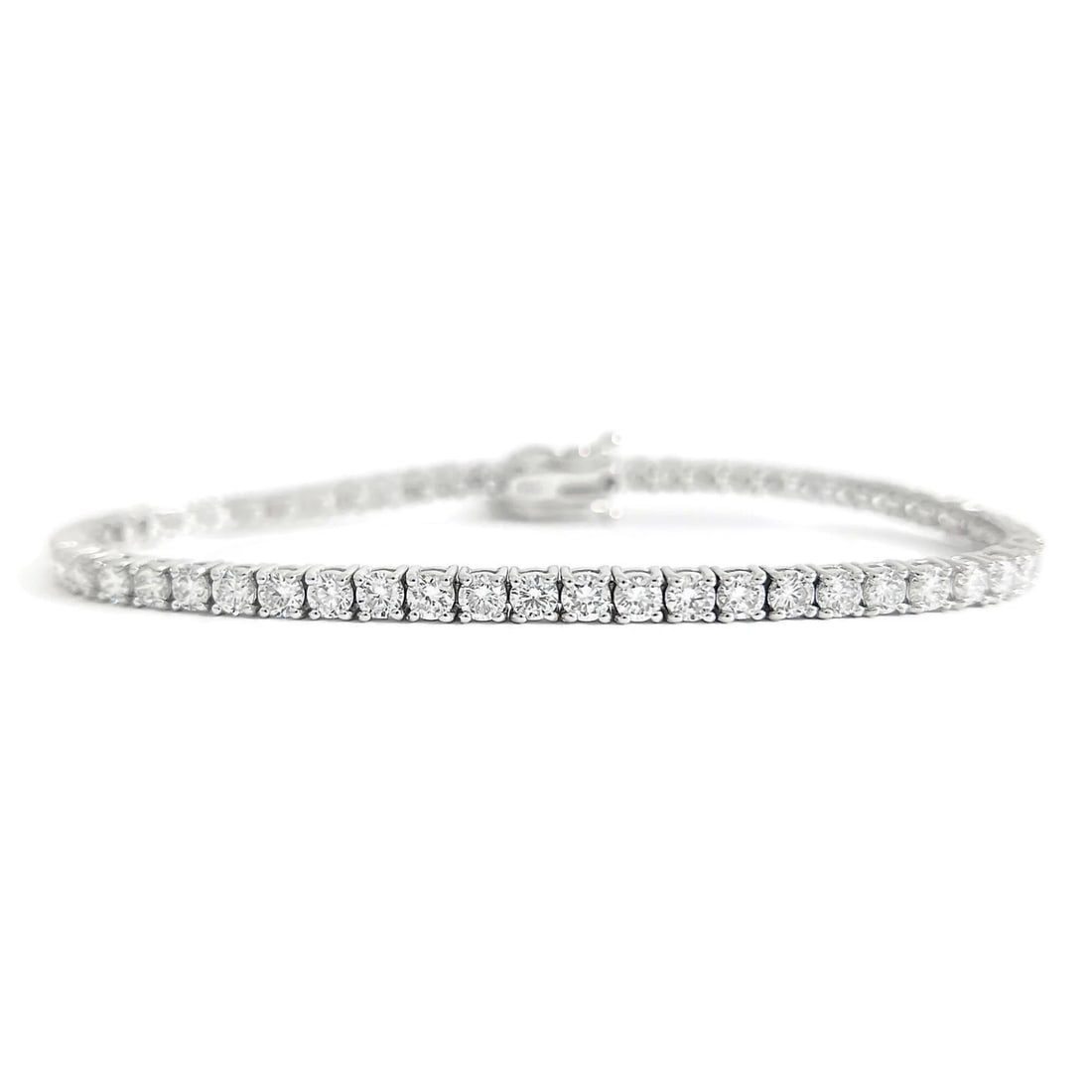 Round Lab-Created Diamond Tennis Bracelet 14K White Gold, 7 Inches, 5.53 CTW: Round Lab-Created Diamond Tennis Bracelet 14K White Gold, 7 Inches, 5.53 CTW This is a gorgeous and classic tennis bracelet! Diamonds: 56 lab-created round brilliant cuts, 5.53 ctw, D-E, VVS1-VVS2, ex