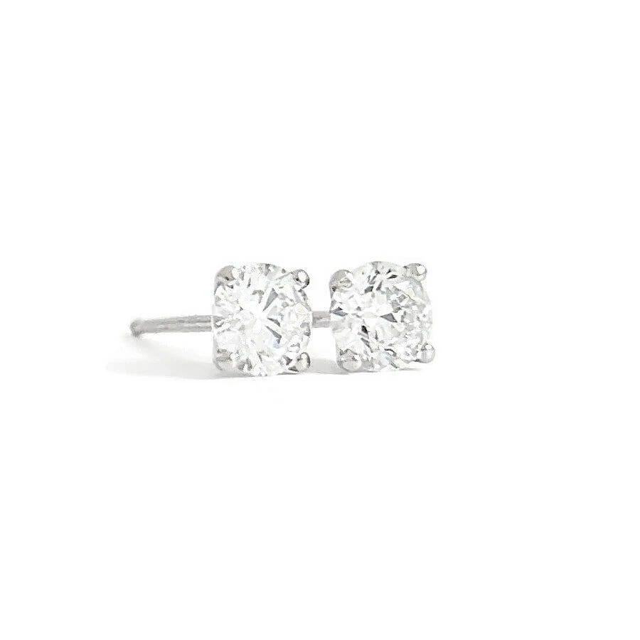 Round Diamond Stud Earrings 14K White Gold 4-Prong Martini, .65 CTW: Round Diamond Stud Earrings 14K White Gold 4-Prong Martini, .65 CTW Diamonds: 2 round brilliant cuts, .65 ctw, G, SI2-I1 Metal: 14K white gold Weight: .81 grams Stamped: 14K Measurements: 4.4 mm
