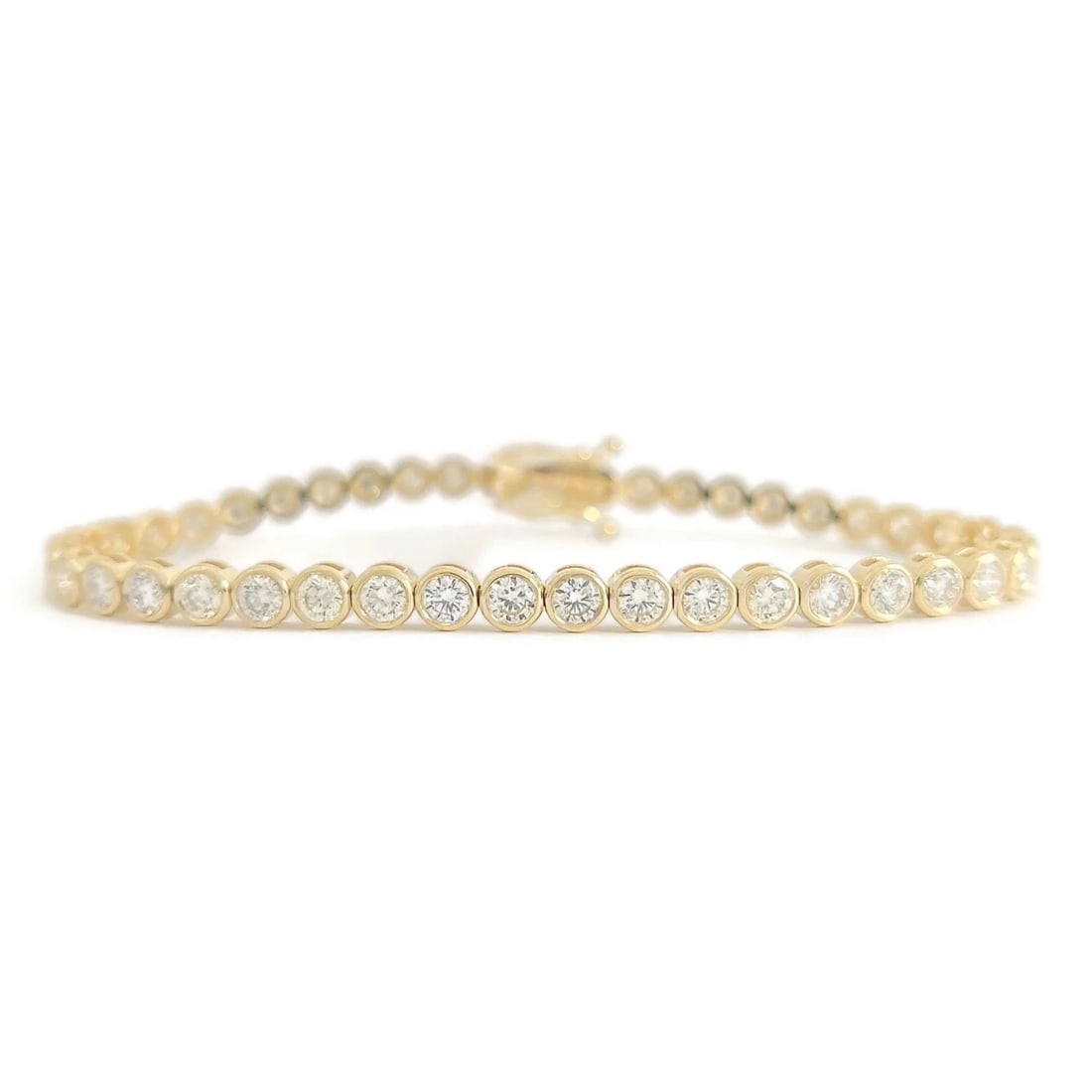 Round Diamond Bezel Tennis Bracelet 14K Yellow Gold, 7 Inches, 4.06 CTW: Round Diamond Bezel Tennis Bracelet 14K Yellow Gold, 7 Inches, 4.06 CTW This is a unique yet classic tennis bracelet! Diamonds: 44 round brilliant cuts, 4.06 ctw, H-I, SI1-SI2 Metal: 14K yellow gold