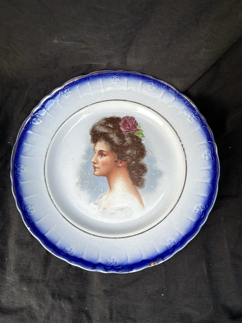 Flow Blue Portrait Plate: It measures 9 1/2" and dates around the late 1800's. It has a very small flake on the rim. Otherwise it has no other issues Shipping: Domestic: Flat-rate of $15.00 to anywhere within the contiguous