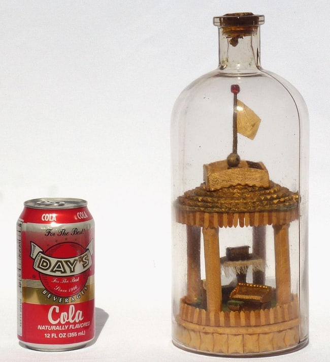 A very intricate carved and tramp art bottle whimsy. - 11