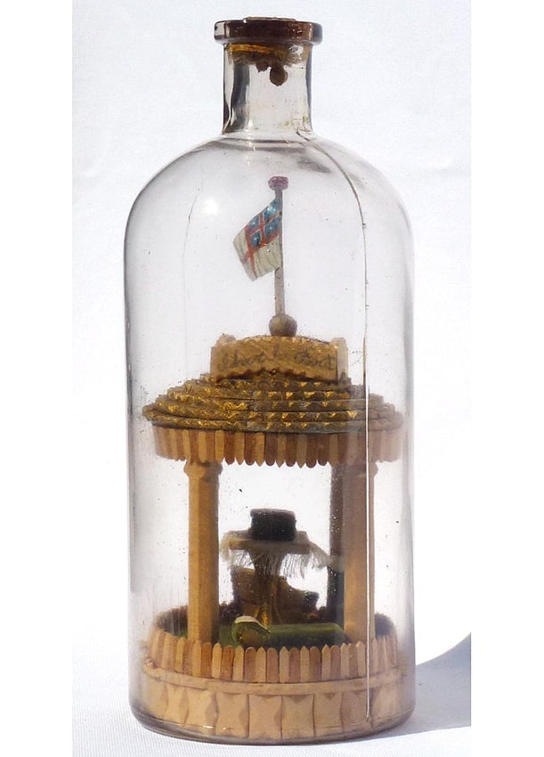 A very intricate carved and tramp art bottle whimsy. - 2