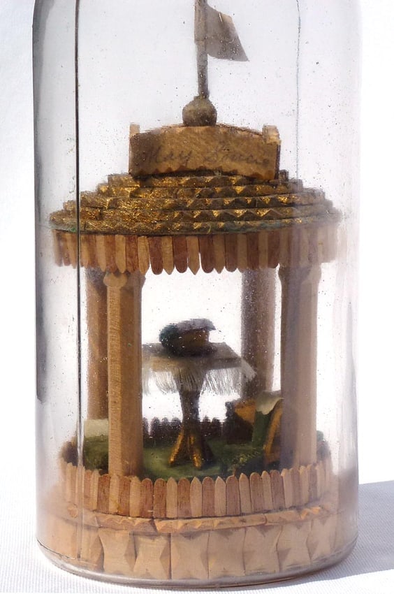 A very intricate carved and tramp art bottle whimsy. - 3