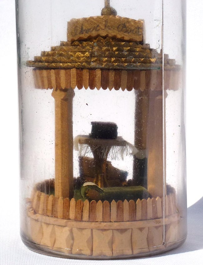 A very intricate carved and tramp art bottle whimsy. - 9