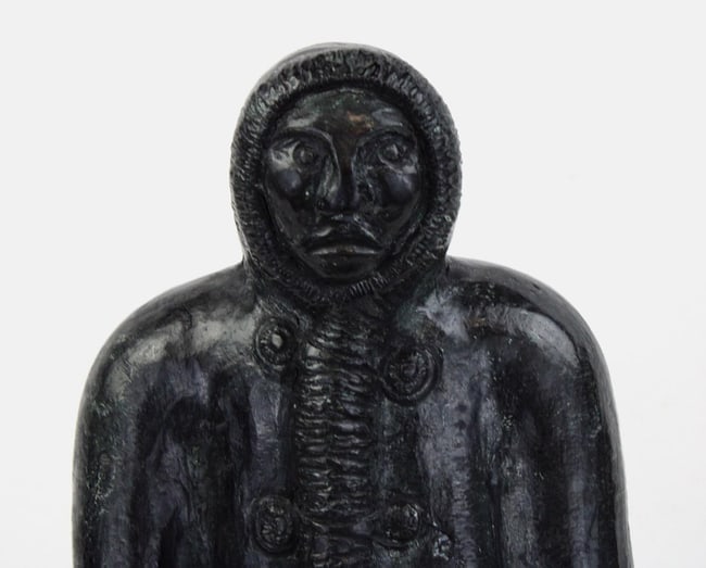 A Native Alaskan stone carving of a man and a seal. - 3
