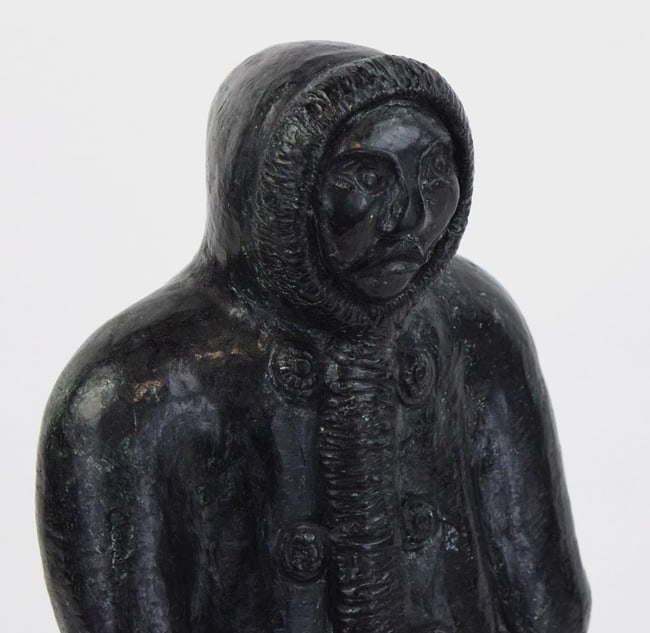 A Native Alaskan stone carving of a man and a seal. - 4