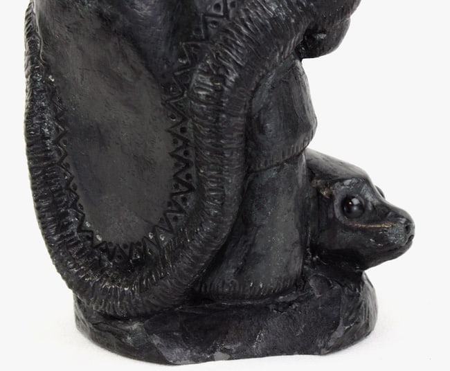 A Native Alaskan stone carving of a man and a seal. - 6