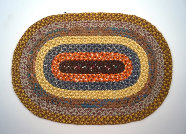 Antique Braided Table Mat County Americana #17: Title: Antique Braided Table Mat County Americana #17 Dimension: App. 13 1/2" long x 9 1/2" wide Date: Ca. 1920's-30's Additional Information: An intricate Antique Braided Table Mat. Oval in shape