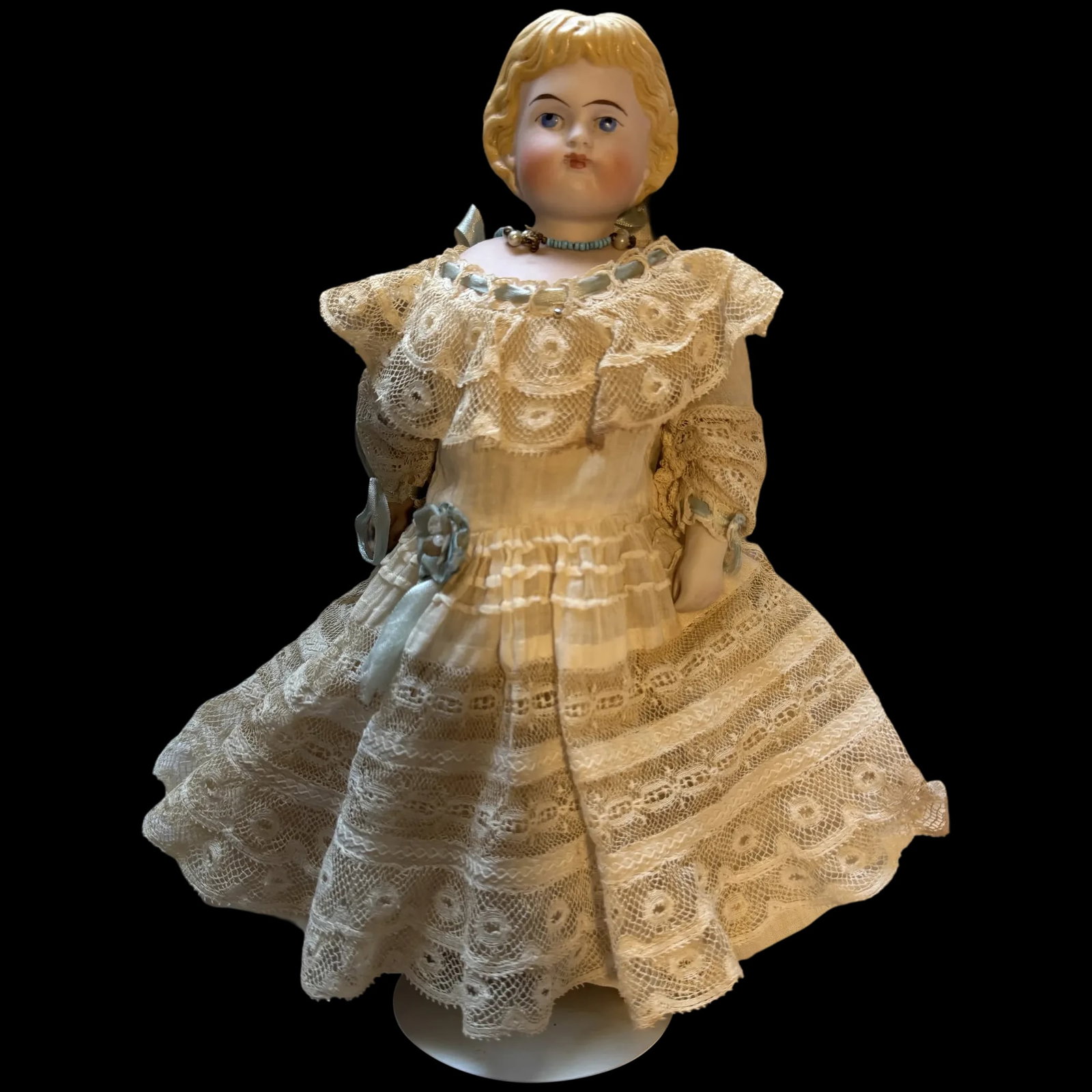 Antique Parian Bisque Doll w/ Beautiful Lace dress 11": The doll stands 11 " tall and she is gorgeous... She has a leather body with lower bisque arms, and her Parian head. The doll has wonderful painted features, There are a few patches due to age and