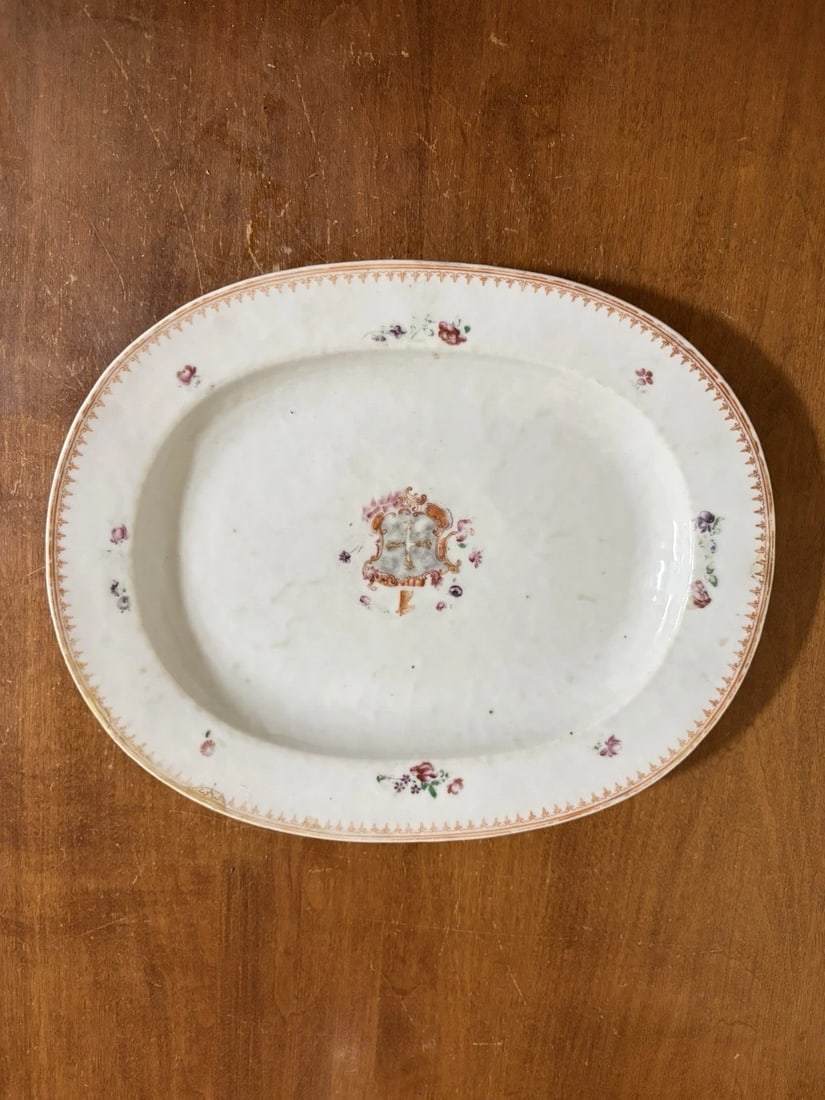19th Century Chinese Export Porcelain Armorial Platter: It measures 11 1/2" x 9 1/2" and dates around the 1850's. It has three small repairs on the rim. Otherwise it has no other issues Shipping: Domestic: Flat-rate of $20.00 to anywhere within the