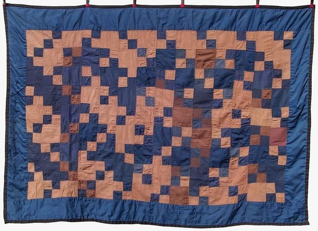 A graphic, Amish child's quilt: This is a wonderful, graphic, Amish child's quilt. It is 45" by 64". The small size makes it perfect for display on a wall, although it certainly can be used on a bed or as an accent piece. It was