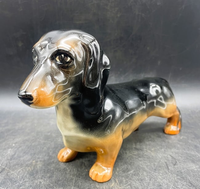 Vintage Beswick England Standing Ceramic Dachshund: Date/Period: unknown Dimension: Approx. 9" x 5.5" Material: porcelain ceramic Additional Information: Vintage Beswick England Brown/Black Standing Ceramic Dachshund 9"x 5.5" Shipping: Domestic: