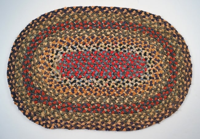 Antique Braided Table Mat Country Americana #14: Title: Antique Braided Table Mat Country Americana #14 Dimension: App. 14 3/4" long x 10" wide Date: Ca. 1920's-30's Additional Information: An intricate Antique Braided Table Mat. Oval in shape and