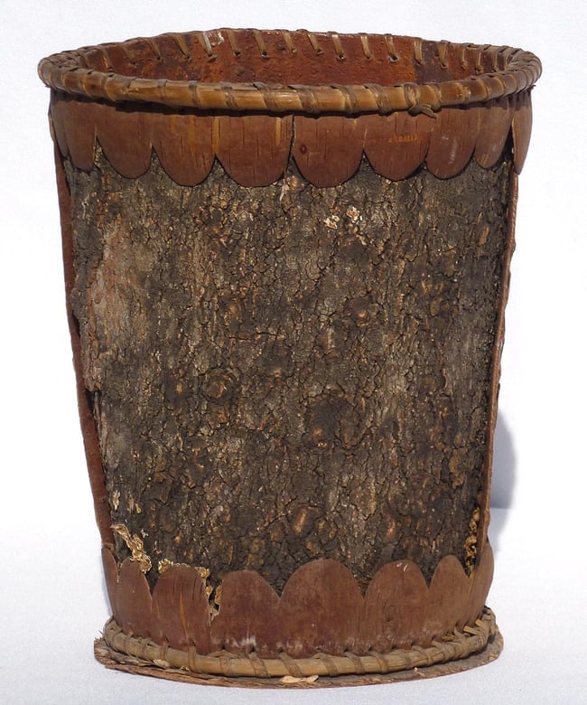 A birch bark vase, possibly made about the 1930's: This is a birch bark vase, possibly made about the 1930's as a souvenir. It has bent wood hoops and scalloped decoration around the top and bottom, and is initialled "KH" in pencil. The condition is