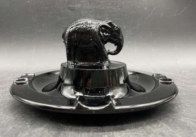 LE SMITH GLASS ELEPHANT ASHTRAY TRINKET DISH: Date/Period: unknown Dimension: Approx 3 x 6.5 Material: glass Additional Information: LE SMITH EBONY BLACK GLASS (with a slight reddish tint) ELEPHANT ASHTRAY VINTAGE TRINKET DISH Shipping: