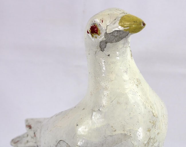 An old concrete dove sculpture - 4