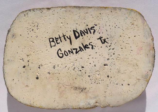 A concrete folk - outsider art plaque by Betty Davis: 3 women's faces - 3