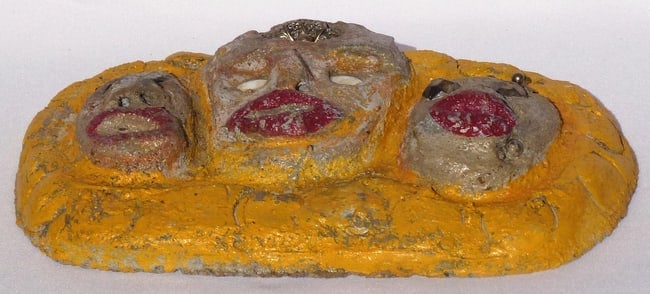 A concrete folk - outsider art plaque by Betty Davis: 3 women's faces - 4