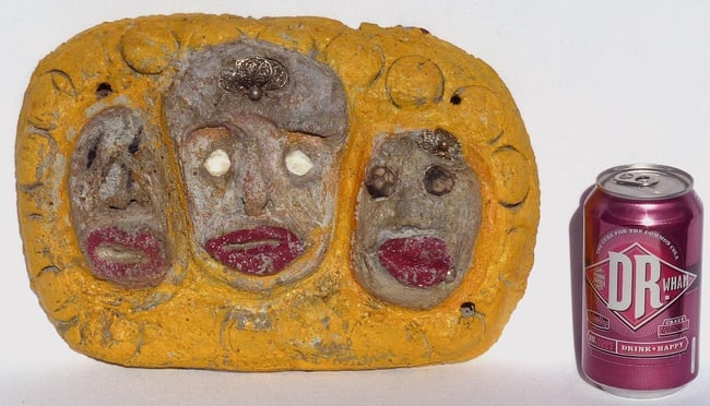 A concrete folk - outsider art plaque by Betty Davis: 3 women's faces - 5