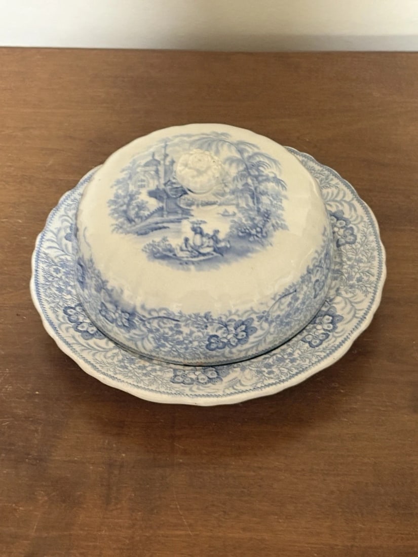 Nonpareil Staffordshire Covered Butter Dish: The bottom measures 9" x 1 1/4" and it is 4 5/8" high and is marked. It has four small flakes on the rim of the dome. Otherwise it has no other issues. It is rare form in staffordshire china