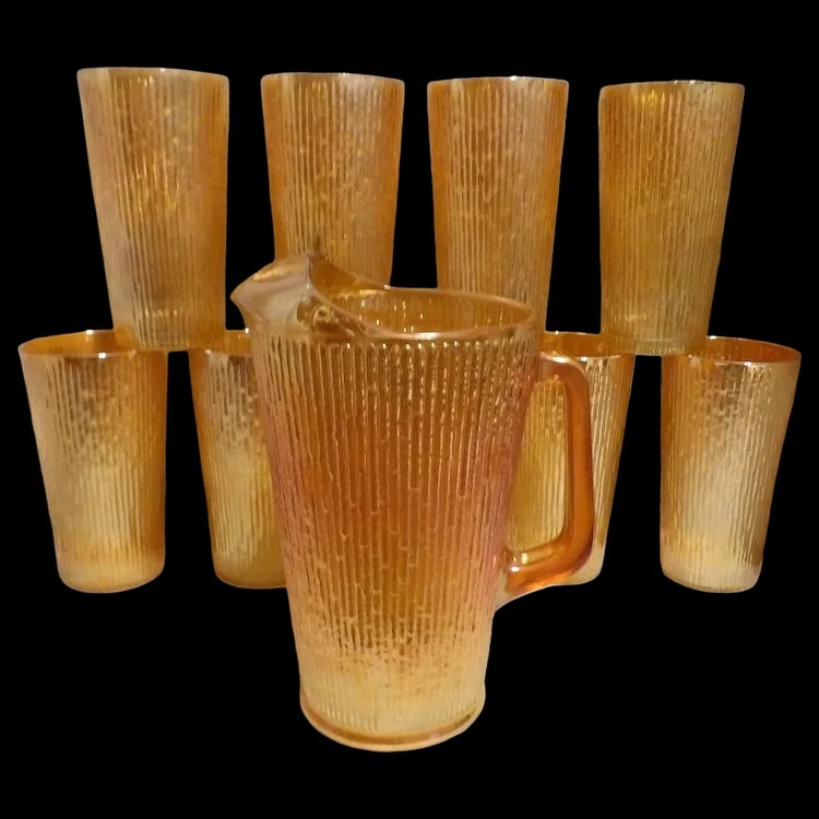 Vintage Jeannette Glass Iridescent Marigold Tree Bark Pattern Pitcher & 9 Rare (23 oz) Iced Tea: This set of Jeannette Glass Iridescent Marigold Tree Bark Pattern Pitcher & 9 Iced Tea Glasses is very unusual it that it contains the large Ice Tea Glasses (23oz. size). (Pictures were taken with
