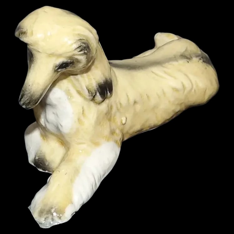 Vintage Afghan Hound Japan: This Vintage Afghan Hound is in excellent condition. It does have some type of bui9ld up on the front paw which I did not try and remove. It measures 4 1/2" in length and is 2" in height and 1 1/2"