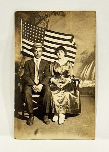 RPPC Real Photo Patriotic Postcard Couple with a Large American Flag 1900 - 2