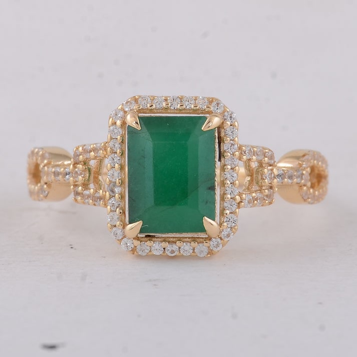1.88 Ct Octagon Emerald 9K Gold Ring: 1.88 Total Carat Emerald 9K Gold Ring Specifications: Total Weight 2.24 g Center Gemstone Emerald Gemstone Carat Weight 1.53 Carats Gemstone Measurements 8X6X4.20 mm Additional Gemstones White