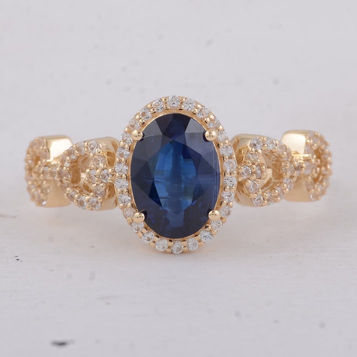 2.06 Ct Oval Sapphire 9K Gold Ring: 2.06 Total Carat Sapphire 9K Gold Ring Specifications: Total Weight 2.58 g Center Gemstone Sapphire Gemstone Carat Weight 1.71 Carats Gemstone Measurements 8.60X6.10X3.60 mm Additional Gemstones White