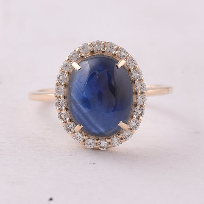 5.30 Ct Oval Sapphire 9K Gold Ring: 5.30 Total Carat Sapphire 9K Gold Ring Specifications: Total Weight 2.723 g Center Gemstone Sapphire Gemstone Carat Weight 4.9 Carats Gemstone Measurements 11X8.90X4.60 mm Additional Gemstones White S