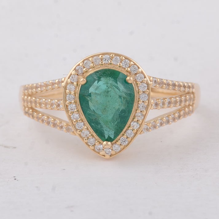 1.52 Ct Pear Emerald 9K Gold Ring: 1.52 Total Carat Emerald 9K Gold Ring Specifications: Total Weight 2.26 g Center Gemstone Emerald Gemstone Carat Weight 1.19 Carats Gemstone Measurements 8X6X3.80 mm Additional Gemstones White