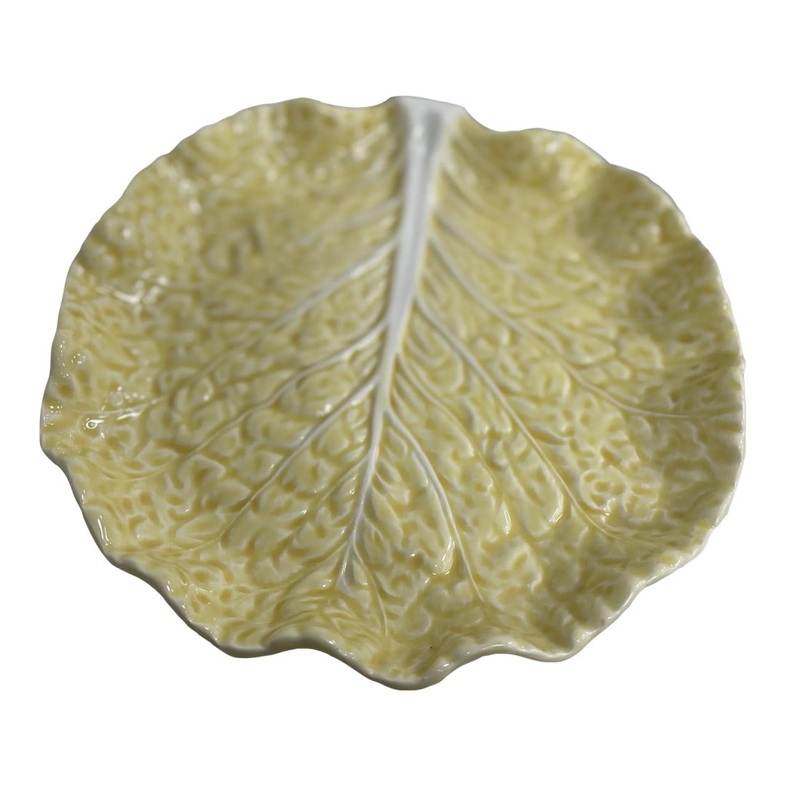 Vintage Bordallo Pinheiro Yellow Cabbage Salad Plate: This plate is crafted from high-quality ceramic, showcasing the characteristic attention to detail and artistic flair that defines Bordallo Pinheiro's creations. The vibrant yellow glaze adds a touch 