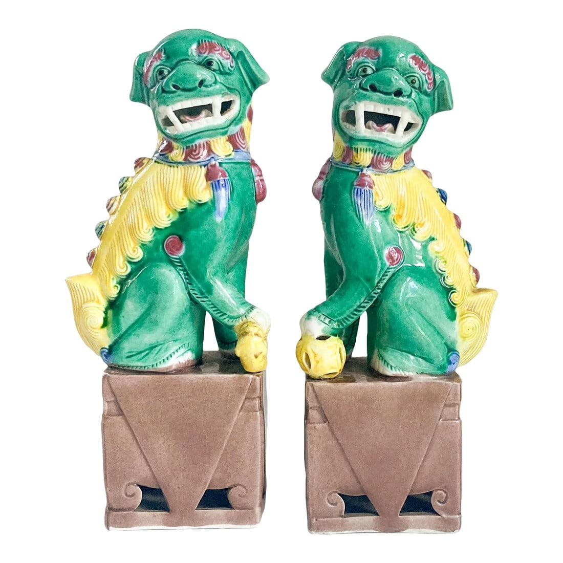 1940's Famille Verte Style Ceramic Foo Dog Figurine Pair: This female and male pair of Famille Verte style Foo Dog figurines are extraordinarily captivating with their vibrant green and yellow glazing. Female dog has a little pup resting under her paw while