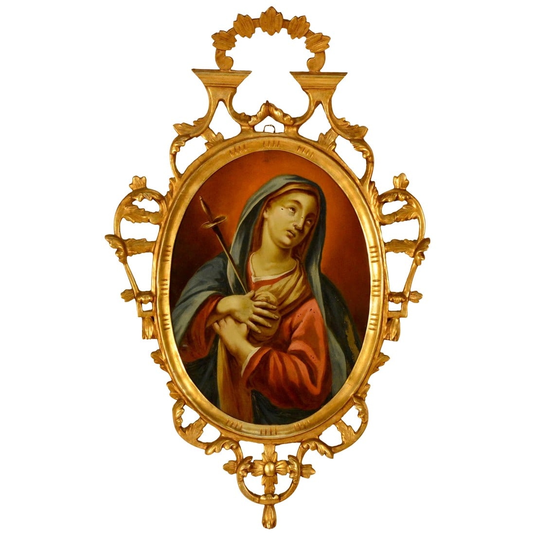 Late 19th Century Spanish Religious Reverse Painting Our Lady of Sorrows: We are offering a Northern Spain religious reverse painting on glass depicting "Our Lady of Sorrows". The painting is enclosed by an arched, gilded wood and gesso frame. The frame is carved with open
