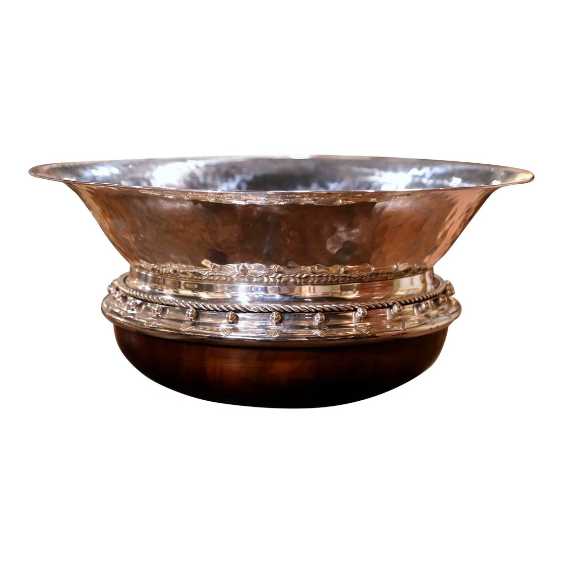 Vintage Spanish Silver Plated Center Piece on Walnut Base Stamped Valenti: Crafted in Spain, circa 1970 and circular in shape, the handmade centerpiece features a hammered silver wide mouth bowl attached to a hand carved walnut base. The large bowl is decorated with rope