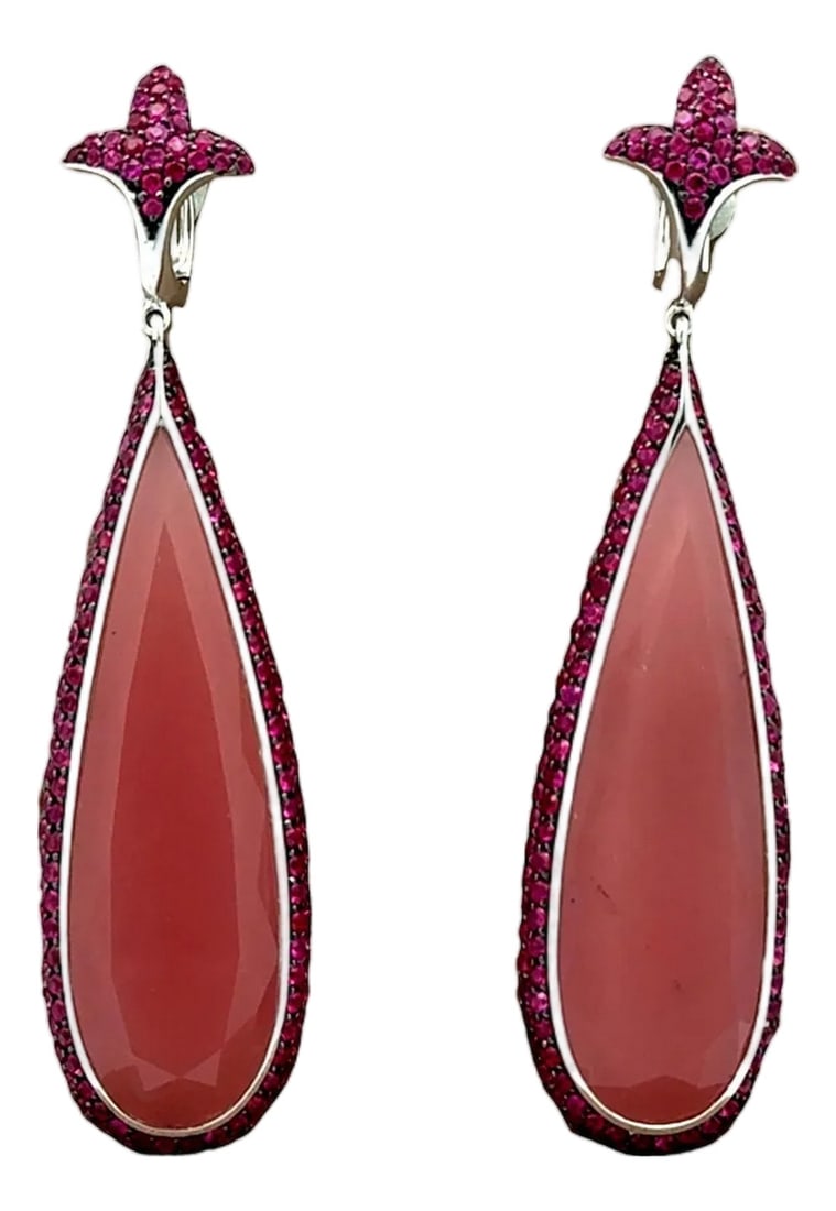 Rose Quartz Ruby 18k White Gold Drop Dangle Earrings- Set of 2: Crafted in 18k white gold, these exquisite dangle earrings are a captivating addition to any collection. Featuring 37.64 carats of long tear-drop rose quartz with a delicate pink hue. The design is